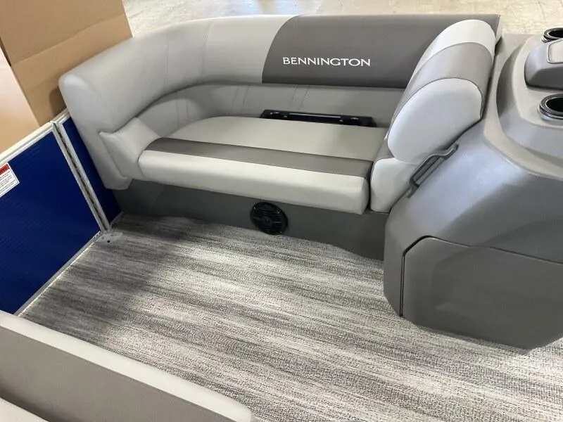 Slide: The Image of 2025 Bennington 168 SL boat interior with gray seating and carpeted flooring. - 32