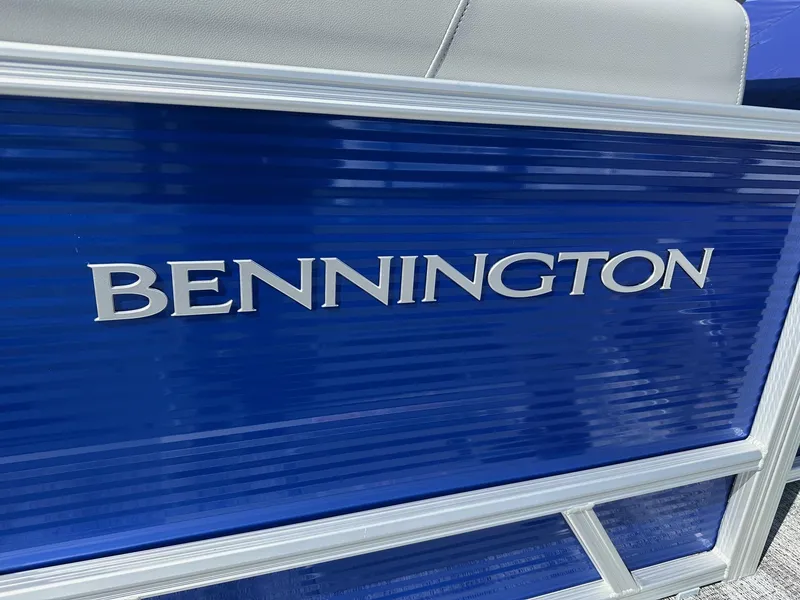 Slide: The Image of 2025 Bennington 168 SL boat, blue exterior with silver logo detailing. - 4