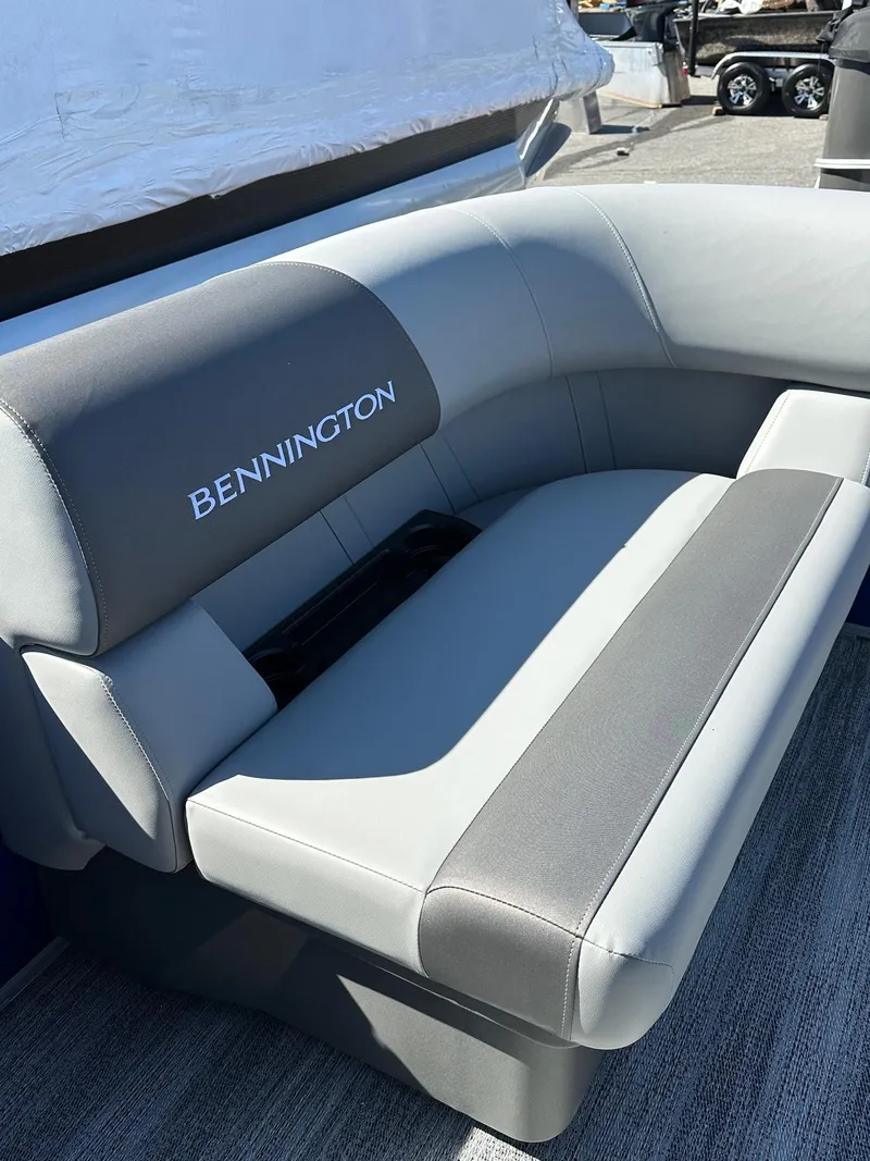Slide: The Image of 2025 Bennington 168 SL boat seat with gray upholstery, outdoor setting. - 6