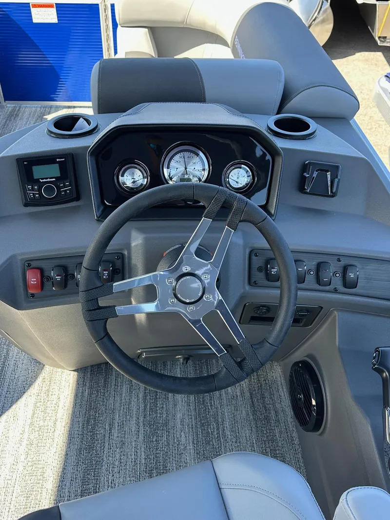 Slide: The Image of 2025 Bennington 168 SL boat dashboard with steering wheel and gauges. - 7