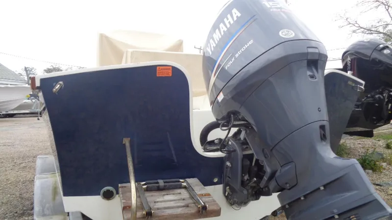 Slide: The Image of 2008 Roth Bilt 21 Classic boat with Yamaha outboard motor, rear view. - 3
