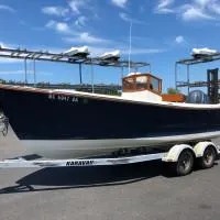 Slide: The Image of 2008 Roth Bilt 21 Classic boat on trailer under clear blue sky. - 4