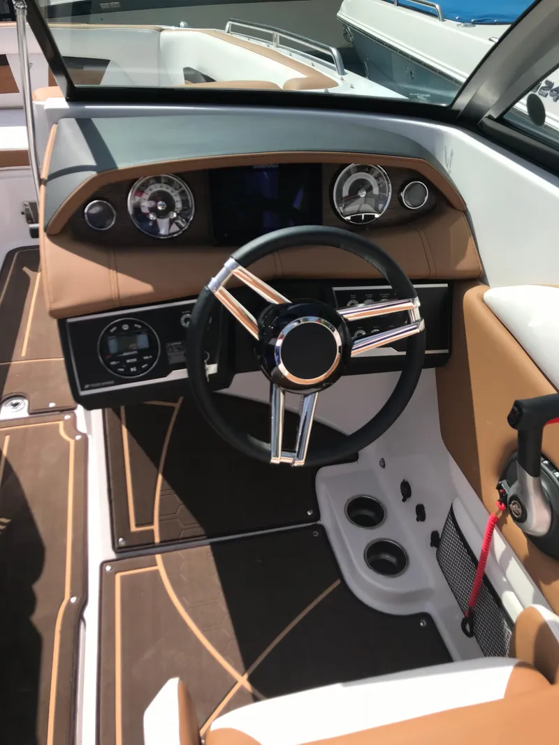 Slide: The Image of Interior of a 2019 Four Winns HD270 boat with modern dashboard. - 10