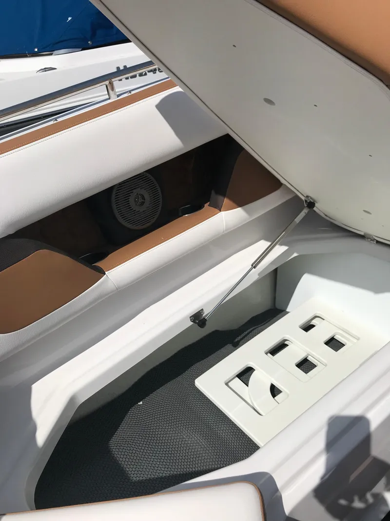 Slide: The Image of Interior of a 2019 Four Winns HD270 boat with storage compartment. - 21
