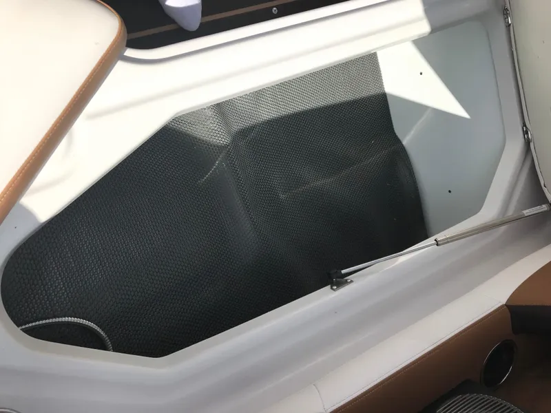 Slide: The Image of Interior of a 2019 Four Winns HD270 boat with storage compartment. - 22