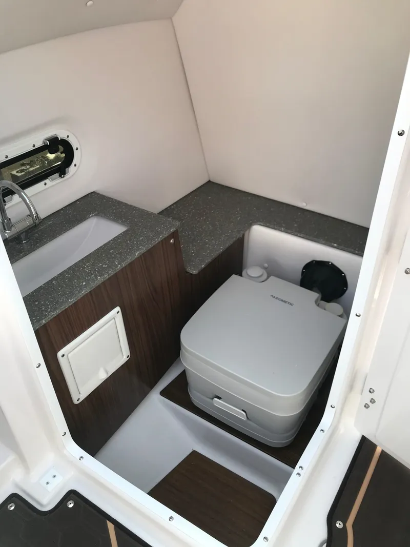 Slide: The Image of Interior of 2019 Four Winns HD270 with toilet and sink. - 3