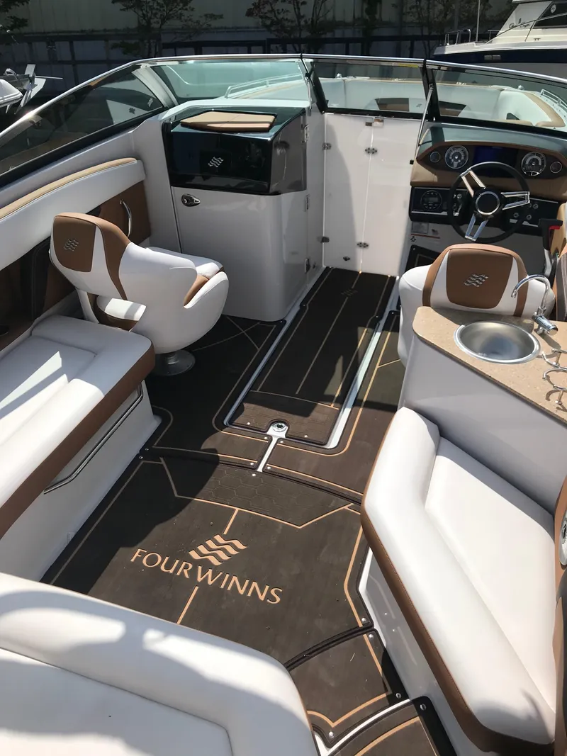 Slide: The Image of Interior of a 2019 Four Winns HD270 boat with luxurious features. - 33