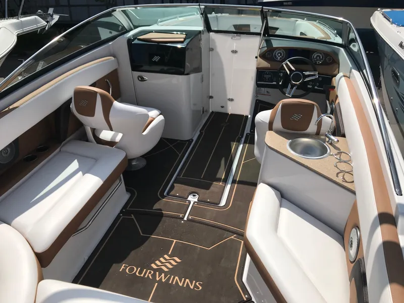 Slide: The Image of Interior of a 2019 Four Winns HD270 boat with luxurious features. - 34