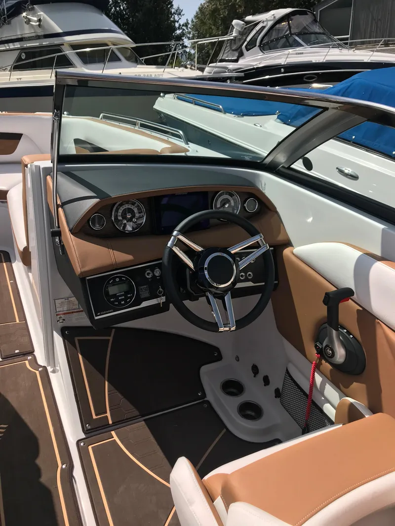 Slide: The Image of Interior of a 2019 Four Winns HD270 boat with modern dashboard. - 5