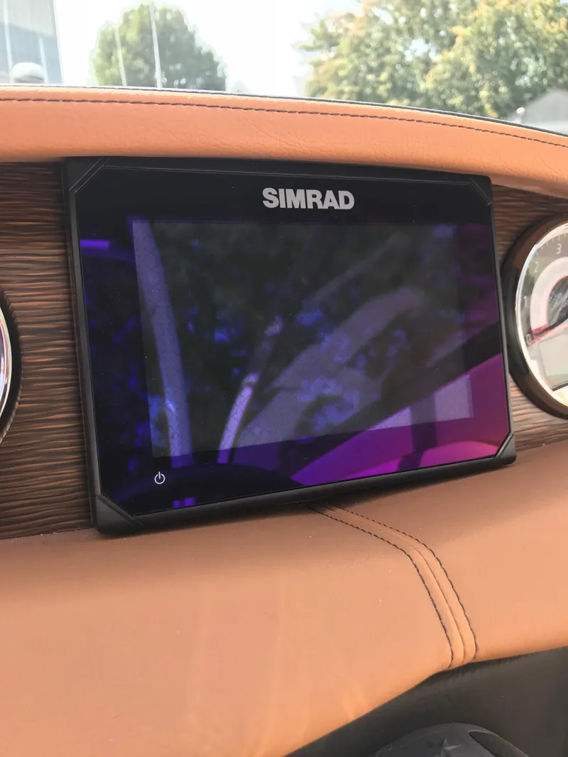 Slide: The Image of Simrad display on 2019 Four Winns HD270 dashboard. - 6