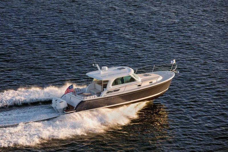 The Image of 2027 Back Cove 34O Hardtop Express cruising on open water, showcasing sleek design and performance. - 0