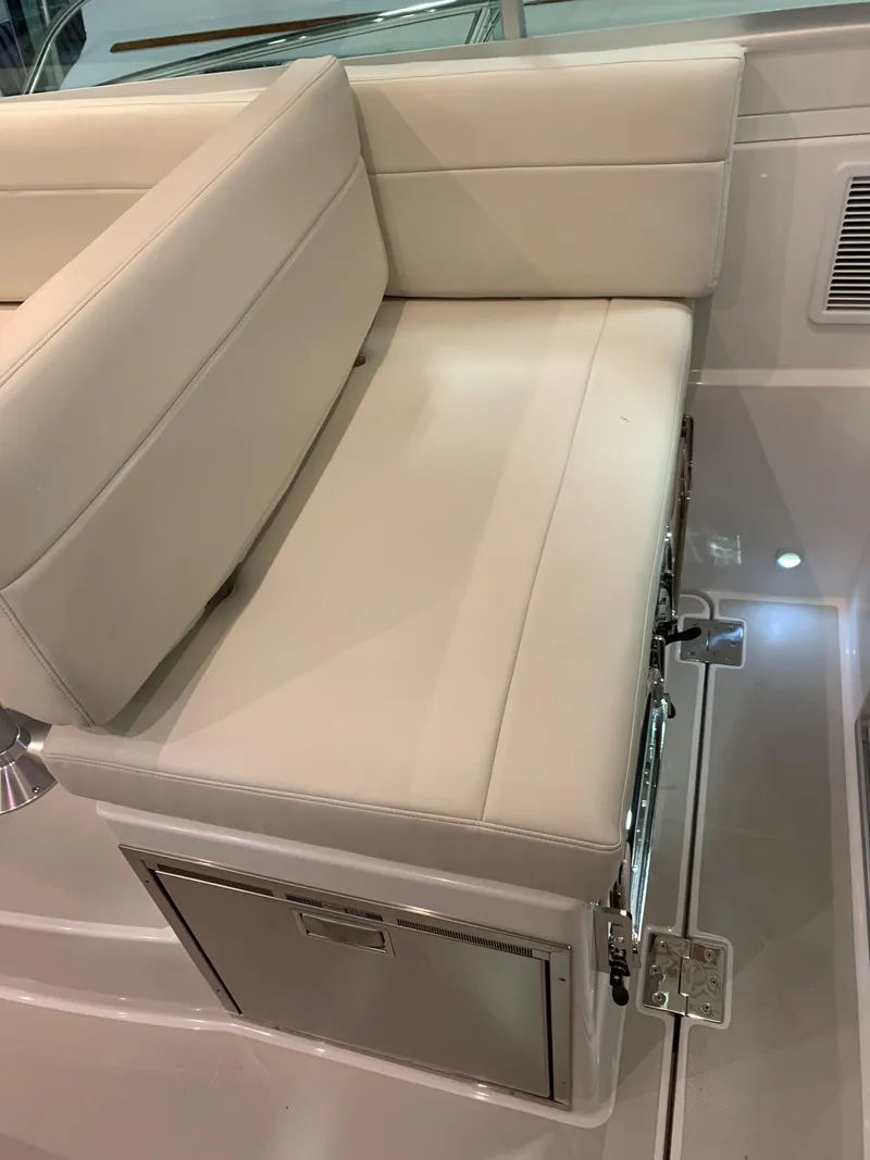 Slide: The Image of 2027 Back Cove 34O Hardtop Express boat seat with storage compartment. - 10