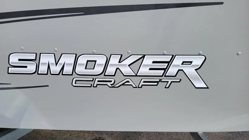 Slide: The Image of Smoker Craft logo on 2023 Freedom 16 tiller deep V boat with Yamaha F25LWHC. - 11