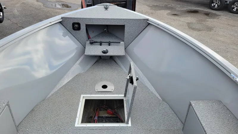 Slide: The Image of 2023 Smoker Craft Freedom 16 tiller deep V interior with storage compartments and Yamaha F25LWHC. - 14