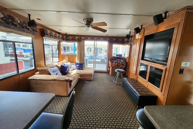 Slide: The Image of Luxurious 2008 Sumerset Blue Moon houseboat interior with cozy seating and modern amenities. - 13