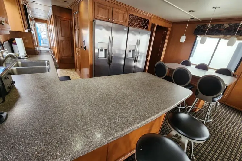 Slide: The Image of Luxurious kitchen interior of 2008 Sumerset Blue Moon Trip houseboat, featuring modern appliances. - 20