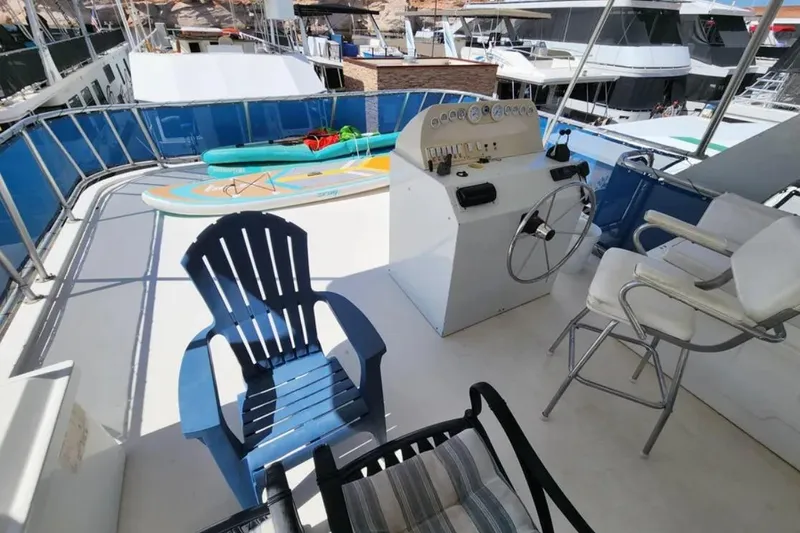 Slide: The Image of Upper deck of 2008 Sumerset Blue Moon Trip #11 with seating and paddleboard. - 23