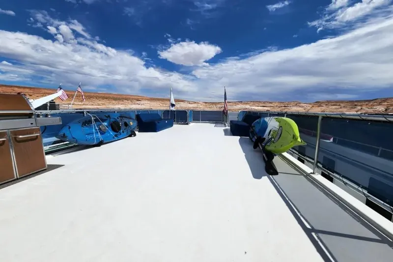 Slide: The Image of Rooftop deck of 2008 Sumerset Blue Moon houseboat with kayaks and scenic views. - 27
