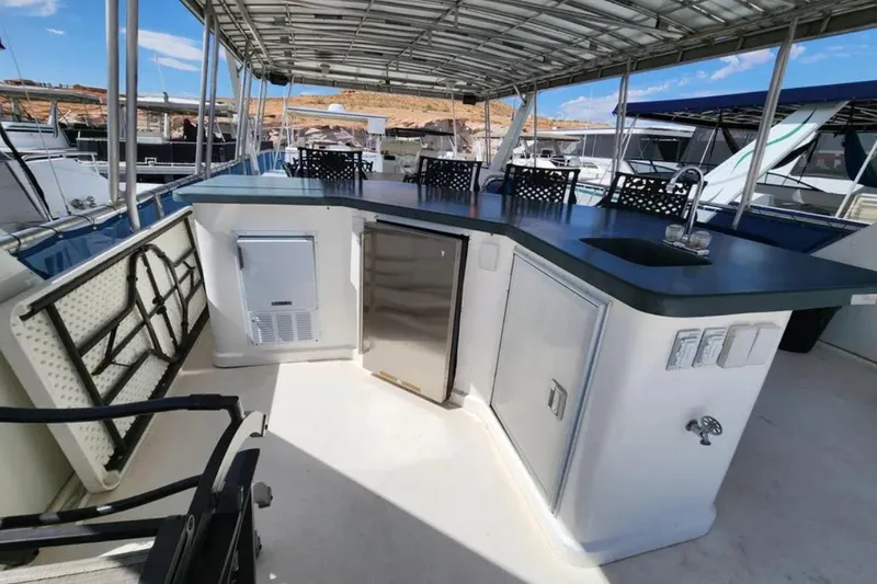 Slide: The Image of Outdoor kitchen on 2008 Sumerset Blue Moon Trip #11 houseboat, featuring sink and appliances. - 28