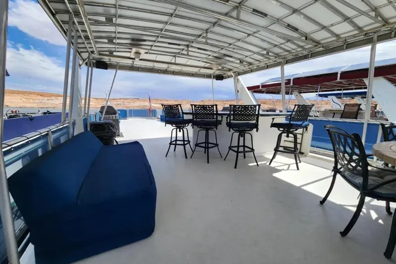 Slide: The Image of Spacious deck of 2008 Sumerset Blue Moon Trip #11 houseboat with seating and bar stools. - 29