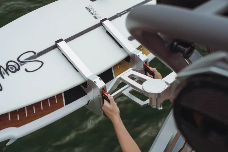 Slide: The Image of 2023 MasterCraft XStar boat with surfboard rack. - 12