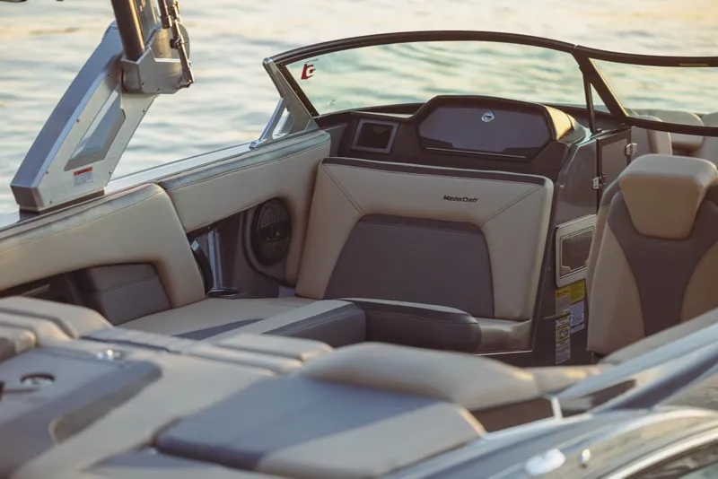 Slide: The Image of 2023 MasterCraft XStar boat interior with luxurious seating and modern design. - 3