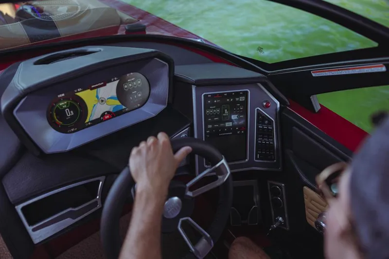 Slide: The Image of 2023 MasterCraft X24 boat dashboard with advanced navigation and control systems. - 7