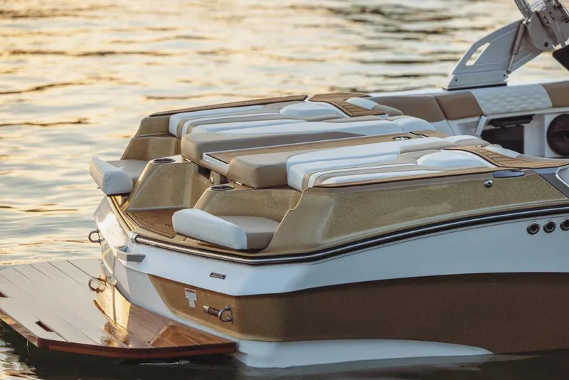 Slide: The Image of 2023 MasterCraft XT20 boat rear view on water. - 18