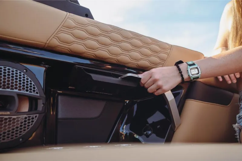 Slide: The Image of 2023 MasterCraft XT22 boat interior with tan leather and speaker. - 5