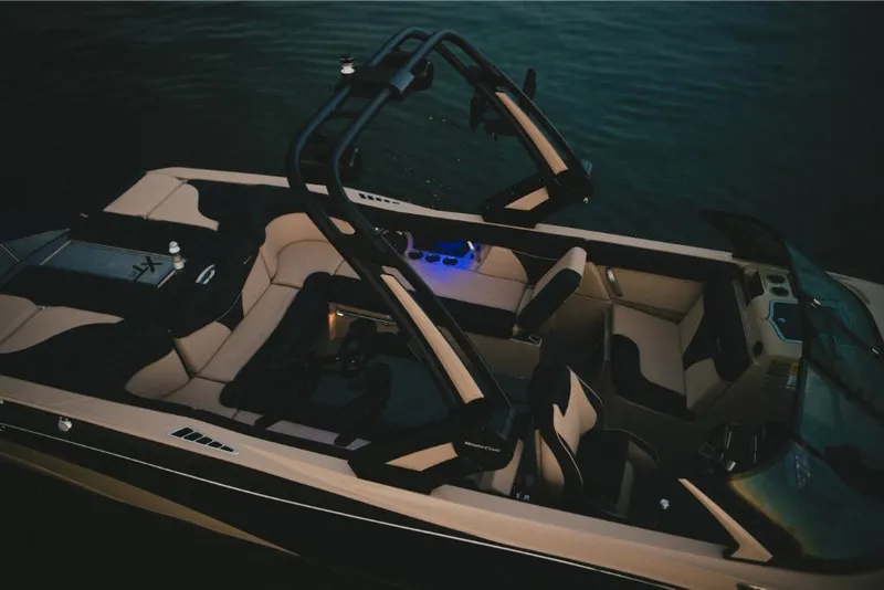 Slide: The Image of 2022 MasterCraft XT25 boat interior with modern seating and blue LED lighting. - 15