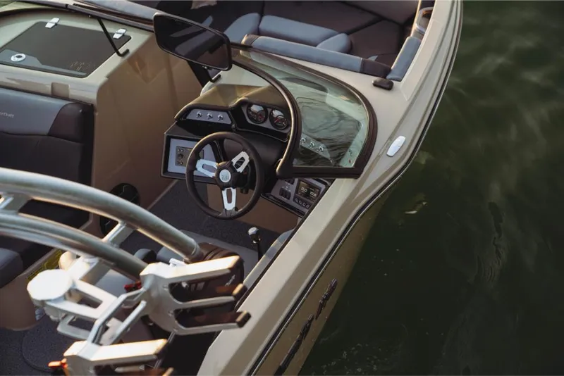 Slide: The Image of 2023 MasterCraft NXT20 boat interior with steering wheel and dashboard. - 10