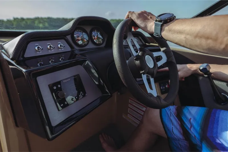 Slide: The Image of 2023 MasterCraft NXT20 boat dashboard and steering wheel close-up. - 5