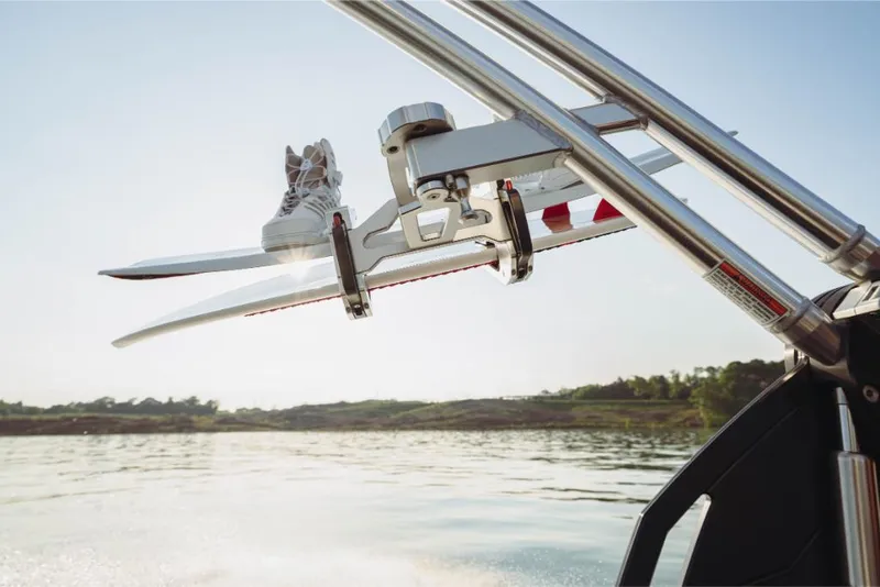 Slide: The Image of 2023 MasterCraft NXT20 wakeboard rack on a lake. - 8