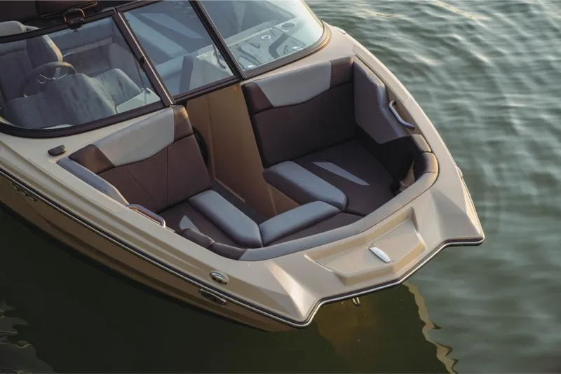 Slide: The Image of 2023 MasterCraft NXT20 boat with luxurious seating on calm water. - 9