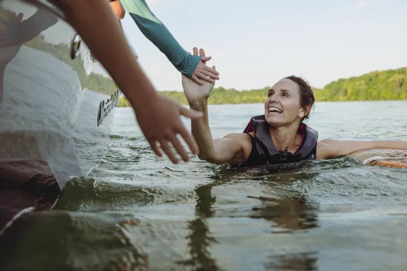 Slide: The Image of Woman in water reaching for help near 2023 MasterCraft NXT22 boat. - 8