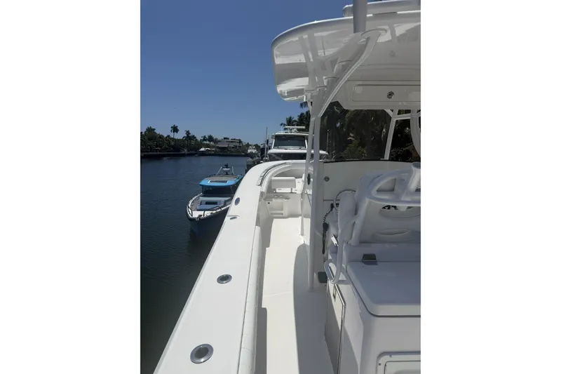 Slide: The Image of 2015 Southport 33 FE boat docked on a sunny day, with clear blue sky. - 13