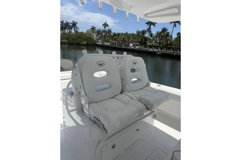 Slide: The Image of Luxury seating on a 2015 Southport 33 FE boat, with waterfront view. - 14