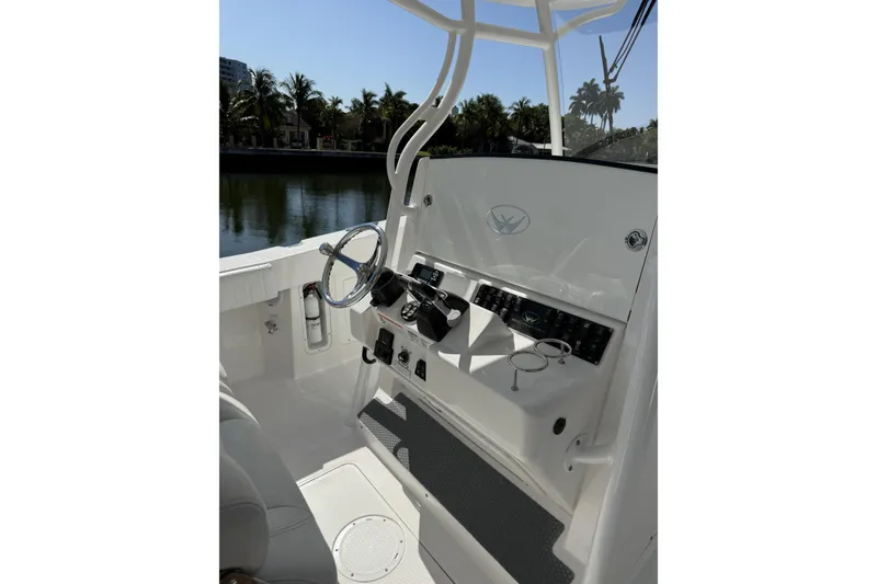 Slide: The Image of 2015 Southport 33 FE boat helm with steering wheel and control panel. - 15