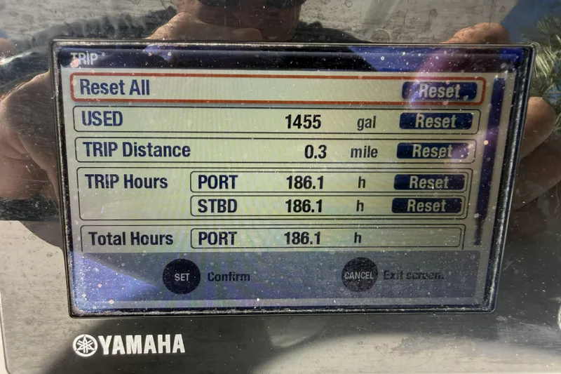 Slide: The Image of Yamaha display showing trip data: 1455 gallons used, 0.3 miles traveled, 186.1 hours logged. - 24