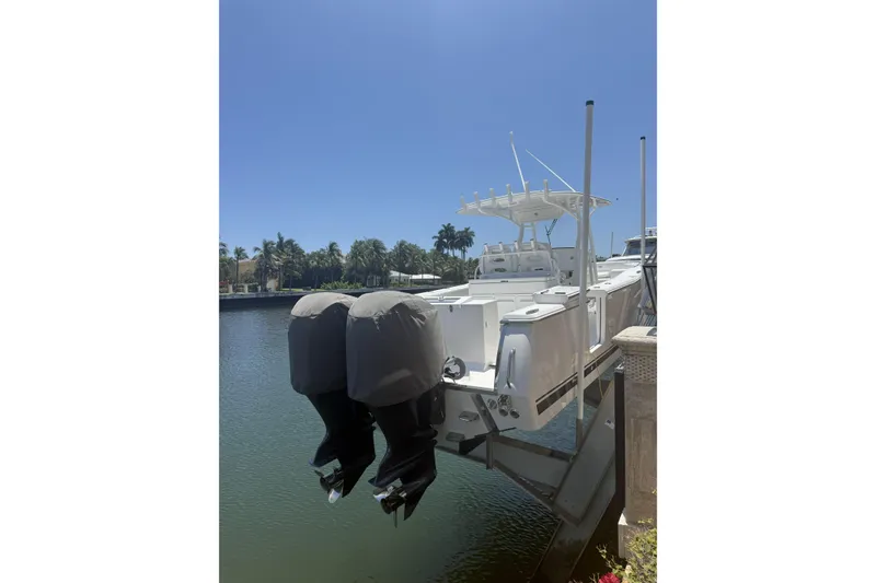 Slide: The Image of 2015 Southport 33 FE boat with dual engines docked by a waterfront. - 3