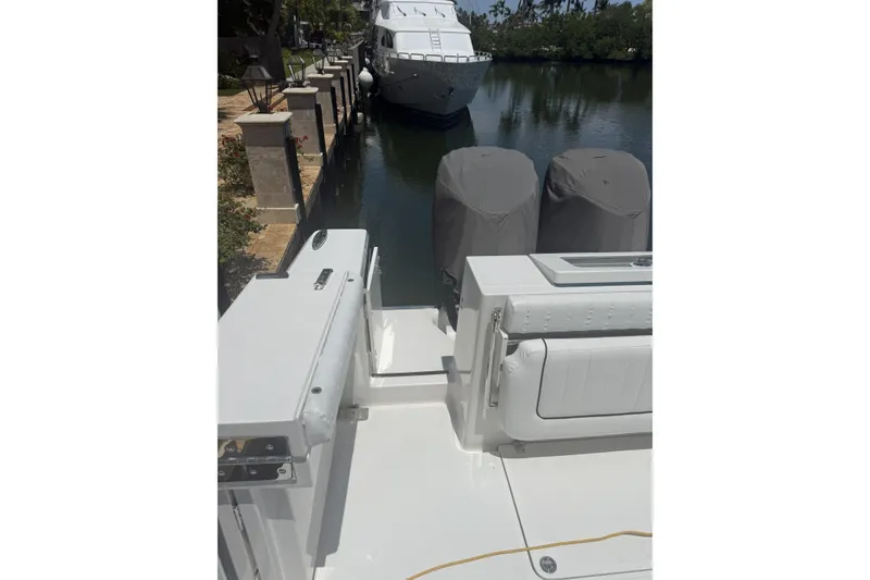 Slide: The Image of 2015 Southport 33 FE boat docked near a canal with covered engines. - 9