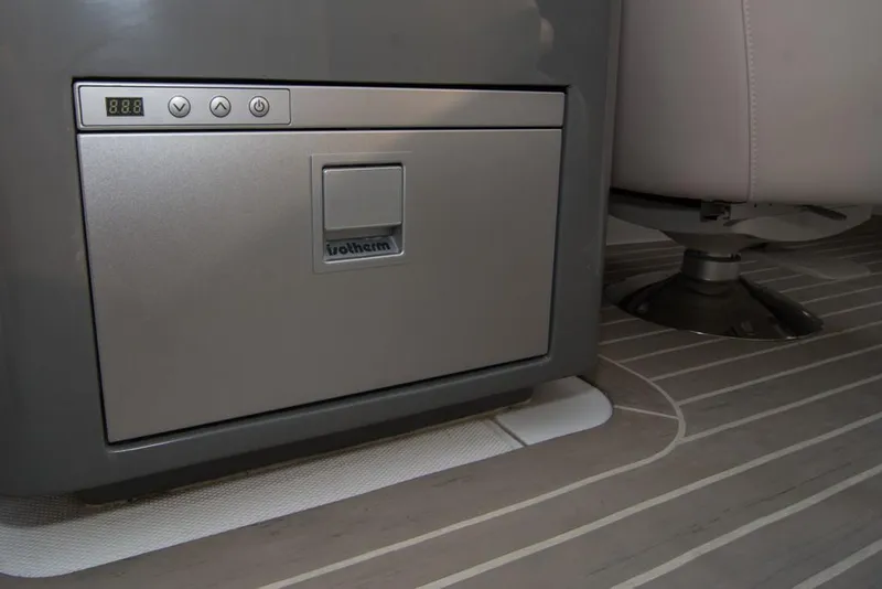 Slide: The Image of 2019 Donzi 41 GT interior, featuring a built-in Isotherm refrigerator and modern flooring. - 19