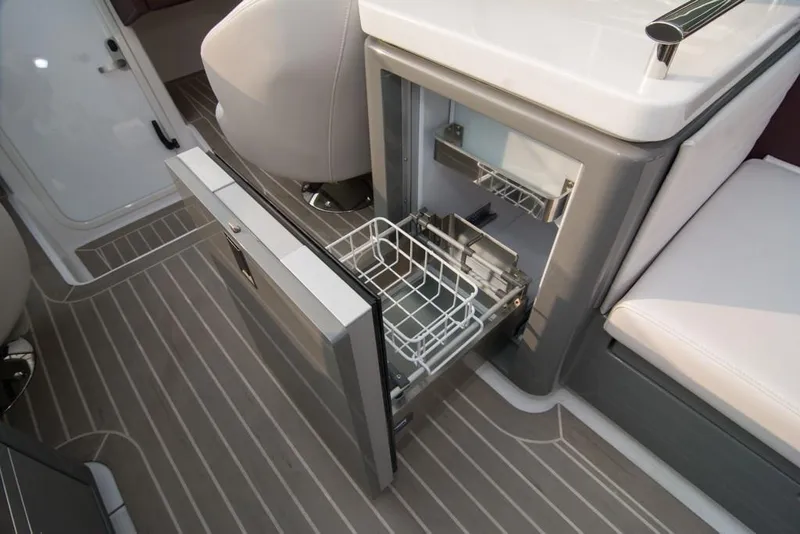 Slide: The Image of 2019 Donzi 41 GT boat interior with open drawer refrigerator. - 22