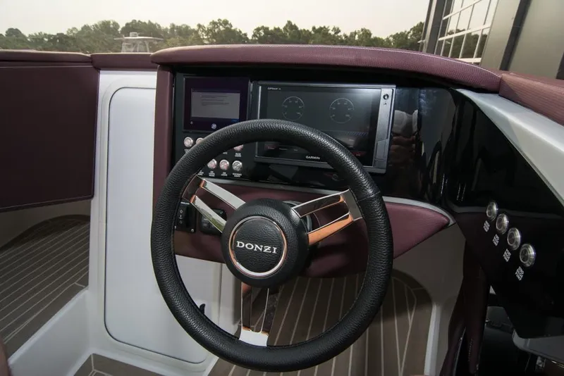 Slide: The Image of 2019 Donzi 41 GT boat steering wheel and dashboard. - 25