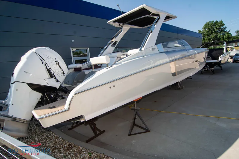 Slide: The Image of 2019 Donzi 41 GT boat on display with twin outboard engines. - 3