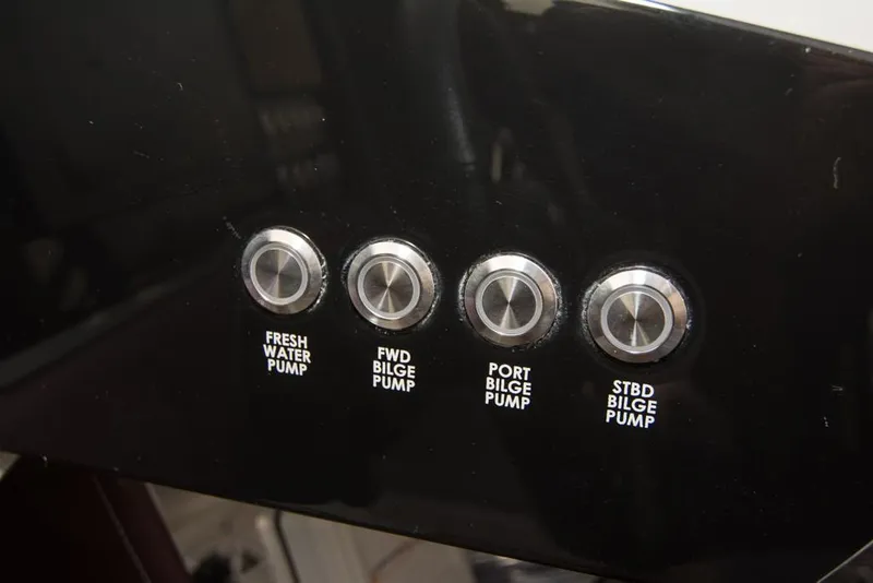 Slide: The Image of Control panel of a 2019 Donzi 41 GT boat with pump switches. - 30