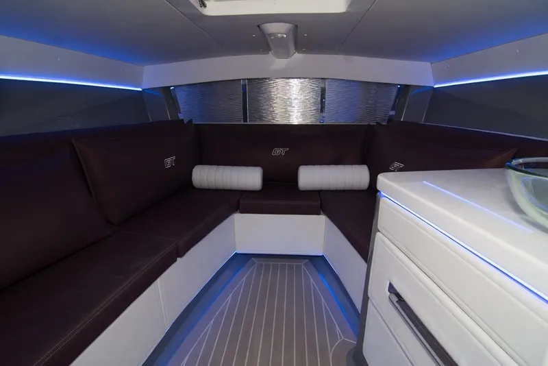 Slide: The Image of 2019 Donzi 41 GT interior cabin with modern seating and ambient lighting. - 39