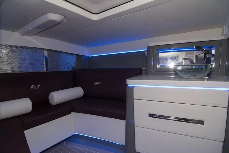 Slide: The Image of 2019 Donzi 41 GT interior with modern seating and kitchenette. - 41