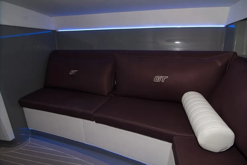 Slide: The Image of 2019 Donzi 41 GT interior seating with leather cushions and ambient lighting. - 42