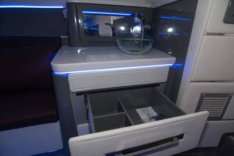 Slide: The Image of 2019 Donzi 41 GT interior with modern sink and open drawer. - 47